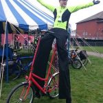 stilt bicycle entertainer