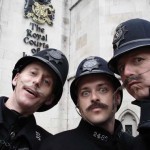 entertainers performing as victorian themed policemen