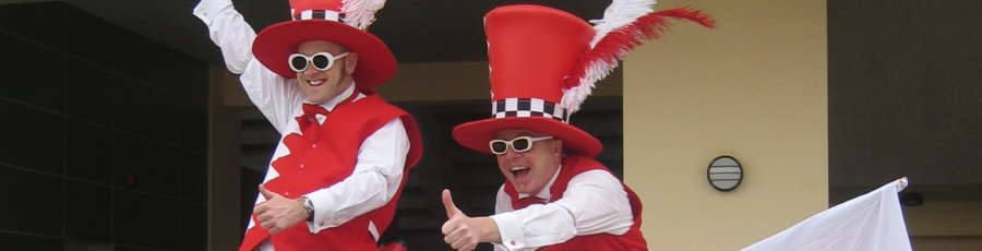 stilt walkers with flags