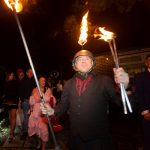 fire juggler with fire helmet