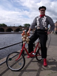 french themed entertainer on a bike