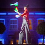 glow juggler on stilts