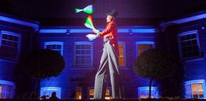 glow juggler on stilts