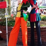 stilt walking jesters