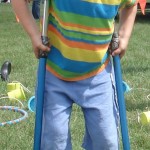 child on stilts