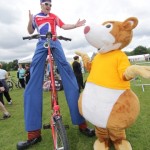 stilt walker on a stilt bike