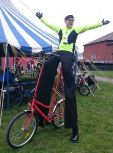 stilt walker on a bike, london