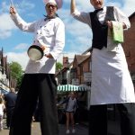 french chef and waiter stilt walkers