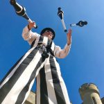 stripey stilt walker juggling