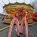 christmas stilt walkers