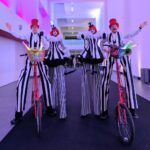 black & white striped stilt walkers