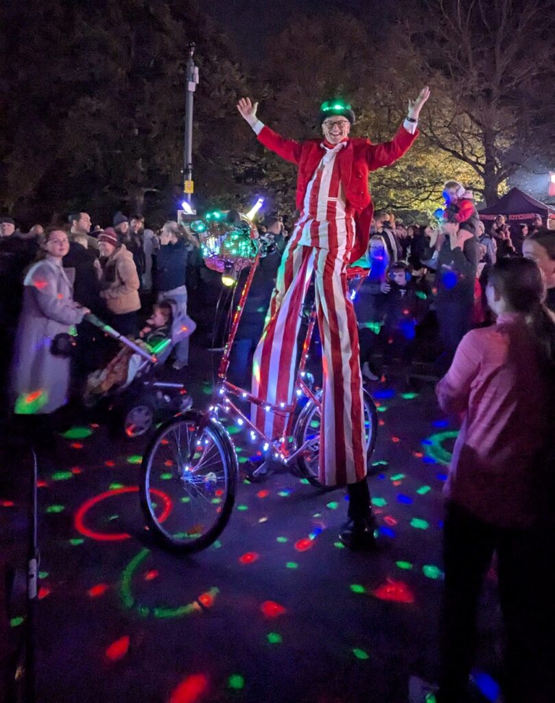 light up stilt walker on a bike with LED